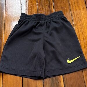 Nike Kids Black Shorts with Yellow Swoosh